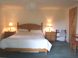 Ground floor bedroom with king size double bed and en-suite.