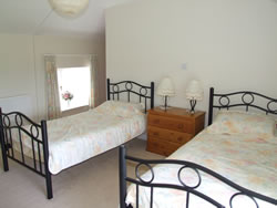 First floor bedroom with twin beds and en-suite.