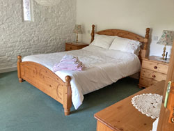 Ground floor bedroom with king size double bed and en-suite.